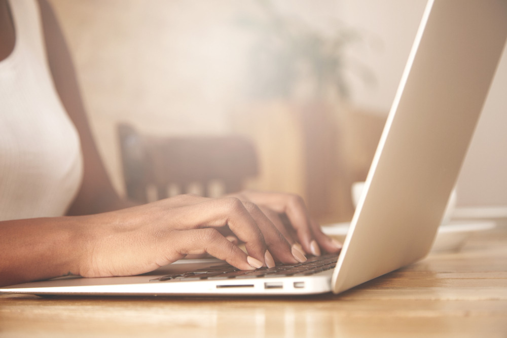 closeup-female-typing-laptop-keyboard